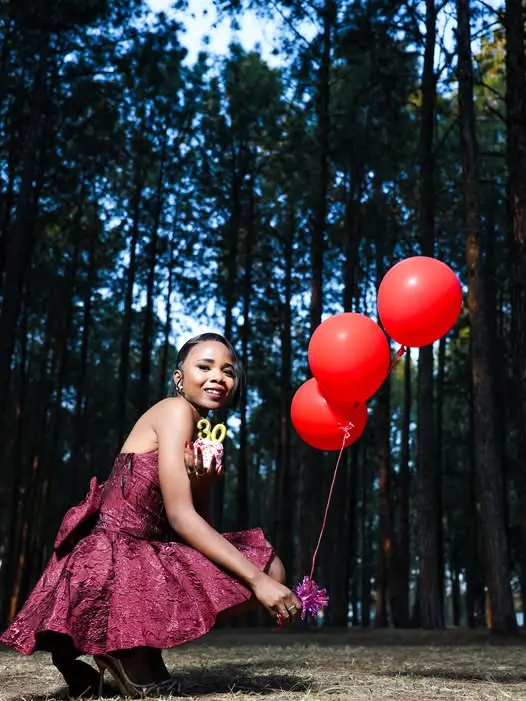A birthday shoot with red balloons