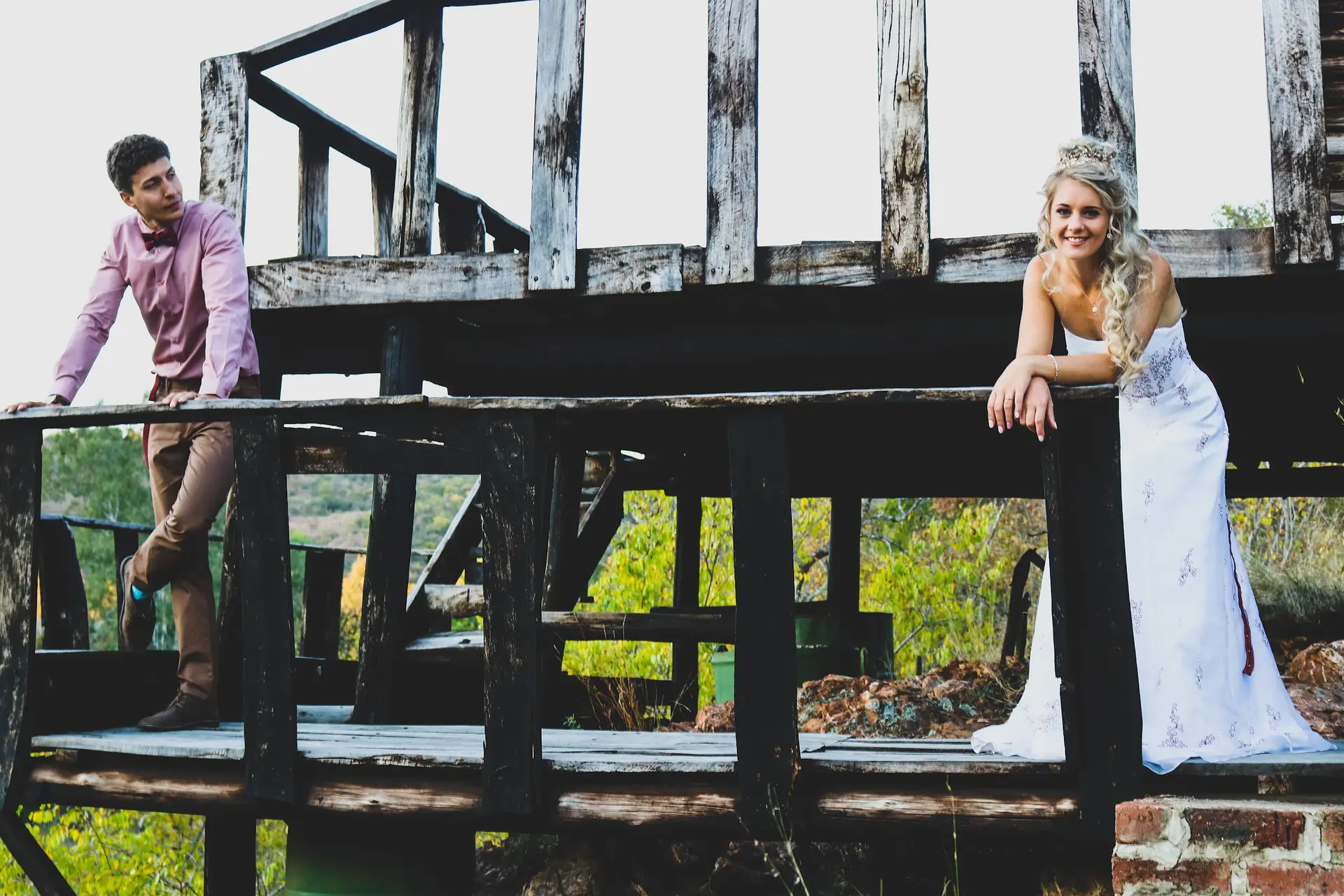 A bride and groom on an old wooden deck