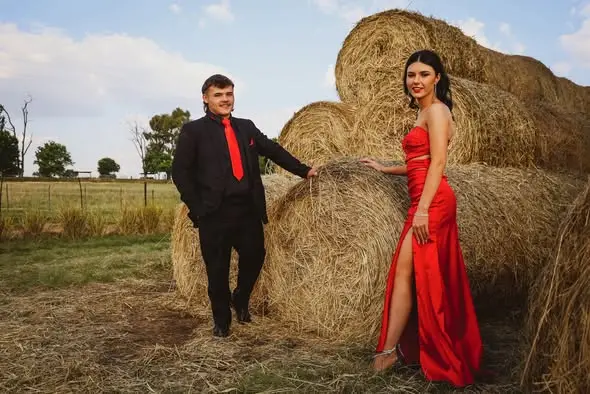 A couple by the hay bales